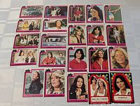 Overhead view of all approximately 20 trading cards laid out