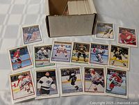 Open card storage box with visible stack and 15 sample cards laid out