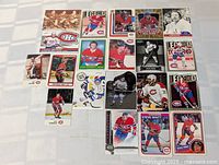 Full layout of roughly 20 Montreal Canadiens cards on tabletop