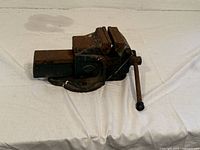 Photo of vintage Victor bench vice showing side profile with tightening handle extended