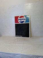 Front view of vintage Pepsi chalkboard with Pepsi logo and chalk writing area