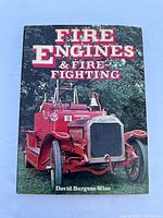Front cover of the hardcover book showing a vintage red fire engine with white and red title text
