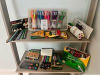 Overview of all art supplies arranged on two shelves