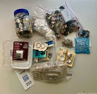 Overview of lot with jar of buttons, bags, carded notions