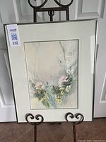 Framed watercolour painting on easel