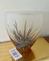 Full view of vase front showing feather design