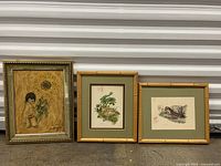 Three framed pieces together showing the full lot: DeGrazia 'Sunflower Boy' painting, deer print, weasel print.