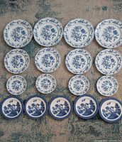 All seventeen plates arranged by size and pattern