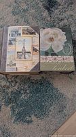 Front covers showing Paris collage and rose designs