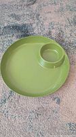 Top view of green plastic chip and dip serving platter