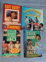 Front covers of the four Dave Barry books laid out together