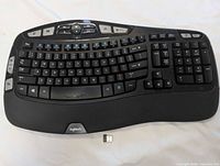 Top view of Logitech K350 wireless keyboard with USB receiver
