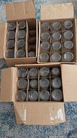 Three cardboard boxes each containing rows of pint canning jars viewed from top, showing 30 jars total