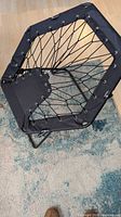 Chair open showing hexagon bungee seat and metal frame