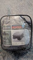 Front of packaged Biddeford heated microplush blanket showing branding and features