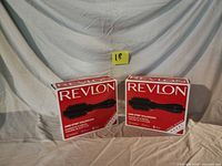 Two sealed Revlon One-Step Volumizer boxes side by side