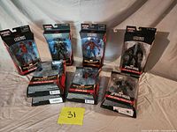 All six boxed action figures displayed front and back rows