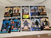 All ten boxed figures laid out in two rows