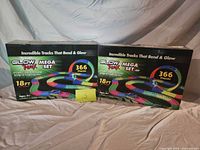 Front view of both sealed Glow Trax Mega Set boxes