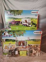 Both boxed Schleich Horse Club playsets with accessory bags