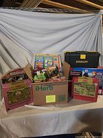 Group shot of entire lot showing puzzles, toolbox, wheelbarrow set, boxed toys