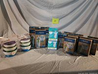 Overall lot showing multiple Dr. Brown’s bottle boxes, Munchkin bowl sets and lot label