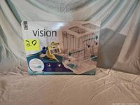 Front of Vision S01 bird cage box showing product image and branding