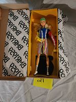 Open box showing Barbie BMR1959 doll with accessories