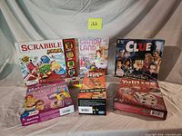 Front view of all seven sealed game boxes