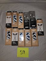 Full lot overview showing 11 boxed earbuds