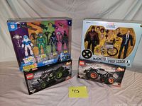 Group shot of all four boxed toy items