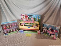 Group shot of three boxed Peppa Pig toys