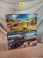 Both boxed Playmobil sets stacked
