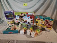 Group shot of all boxed and tubbed toys on table