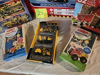 All items laid out including craft kits, vehicle set, partial puzzles