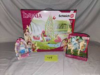 Overall lot with three packaged toys; Schleich Bayala boxed playset, Schleich fairy on horse figure, Disney Princess doll