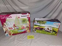 Both sealed Schleich boxes with lot card
