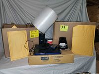 Full view of lot showing scale, bubble wrap, padded envelopes, Dymo printer, Uline carton