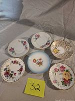 Top view of six assorted floral saucers