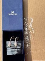 Swarovski drop earrings set in original blue box, showing full view of earrings within box