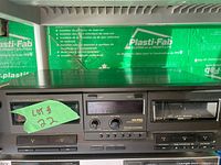 Front view of Technics RS-TR232 stereo double cassette deck showing two cassette compartments, control buttons, and audio level dials.