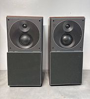 Front view of both speakers with lower cloth grilles attached