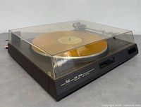 Front-quarter view with dust cover closed displaying Dual CS-515 logo and front controls