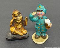 Front view of both figurines clearly showing details, colors, and expressions