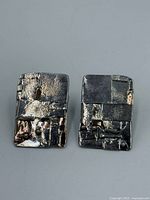 front view of both rectangular mixed-metal earrings