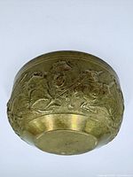 Base view showing full exterior relief of mounted warriors