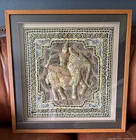 Front view of framed Kalaga tapestry with elephant and rider scene