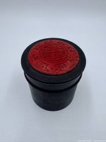 Full view of box with lid on, highlighting shape and materials