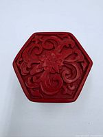 Top view showing hexagonal shape and carved floral motif