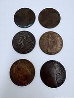 Full view of six bronze pennies front sides